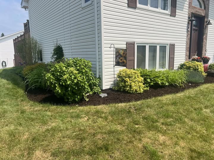 Landscaped front yard with garden beds, Halifax NS